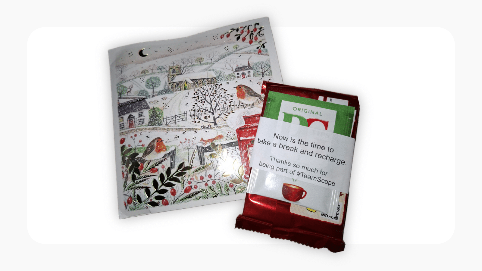 An image showing the gifts Scope sends their fundraisers at the end of the year, including a teabag, a festive card, and a KitKat.